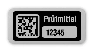 Prüfmitteletiketten Material:Folie silber matt Größe:26x12mm Kopfzeile:"Prüfmittel" Barcode:DataMatrix Stellenanzahl:5-stellig Ausführung:1 Etikett pro Nummer Etiketten je Rolle:100